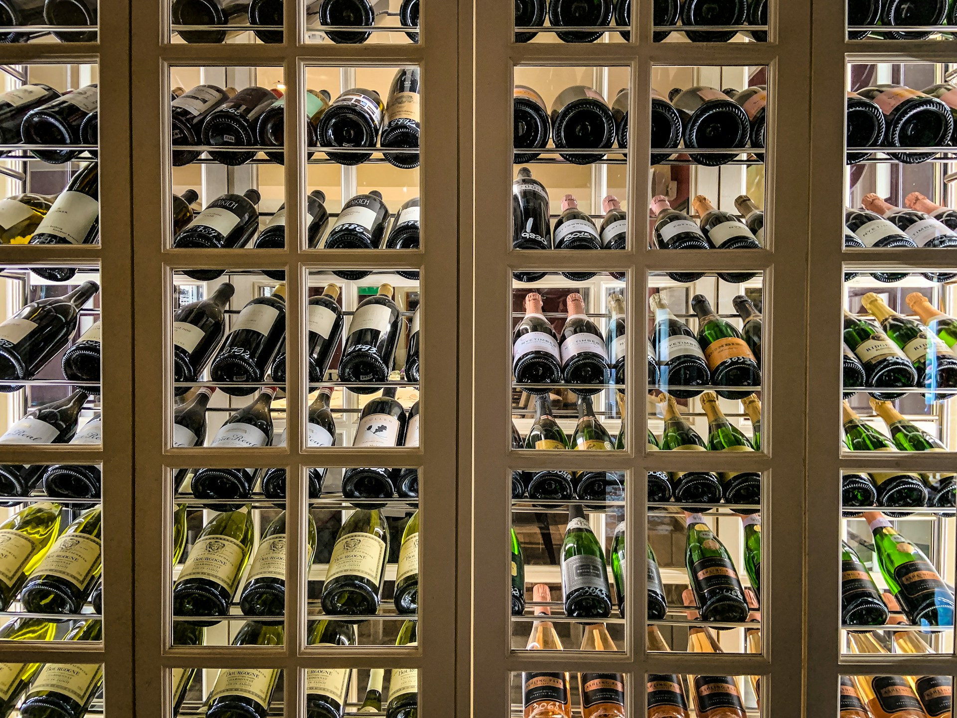 Using Custom Wine Cellar Doors to Protect Seasonal Inventory